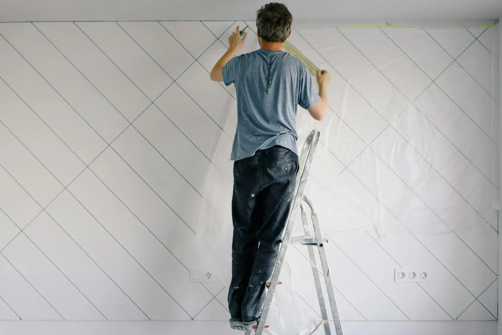 Craftsman working on a custom home project with careful attention to detail.